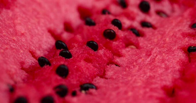 pieces of red ripe watermelon with a small number of seeds, ripe and juicy red watermelon on the table