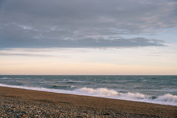 Shingle beach on a cloudy winter late afternoon, can be used as a background