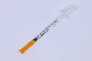 Insulin syringe with cap isolated in a white background