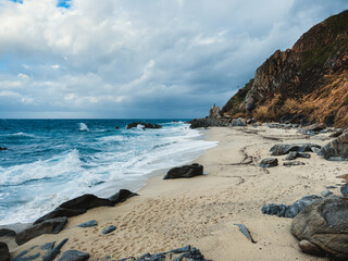 Fototapeta na wymiar Beach in stormy ocean in Calabria winter season