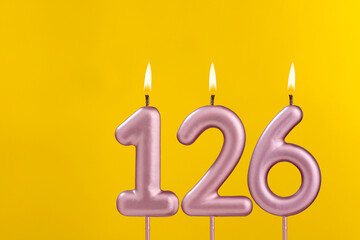 Birthday candle number 126 - Birthday celebration on yellow background
