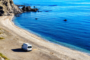 Fototapeta na wymiar Caravan van on beach. View from above