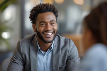 Smiling Manager Interviewing an Applicant In Office - Powered by Adobe