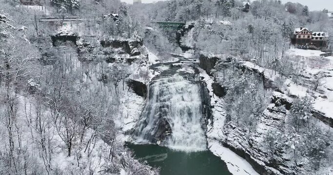 Afternoon winter aerial video of Ithaca Falls on Fall Creek, City of Ithaca, NY, USA 01-14-2024