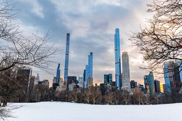 Fototapeta na wymiar Winter view on Manhattan cityscape buildings at scenic sunset from Central Park