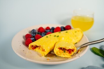 Homemade classic French Omelette served with fresh fruits