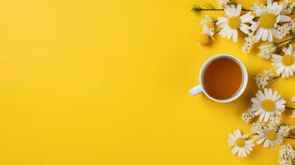 Rollo Chamomile tea and daisies composition with copy space for text on wooden background © Ilja