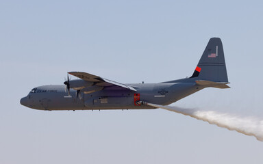 C-130J in a firefighting drop - obrazy, fototapety, plakaty