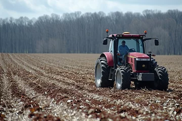 Rolgordijnen tractor in a crop field  © marsone