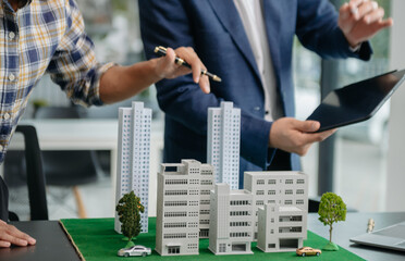 balancing the property sector The real estate agent is explaining the house style to see the house...