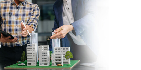 balancing the property sector The real estate agent is explaining the house style to see the house...
