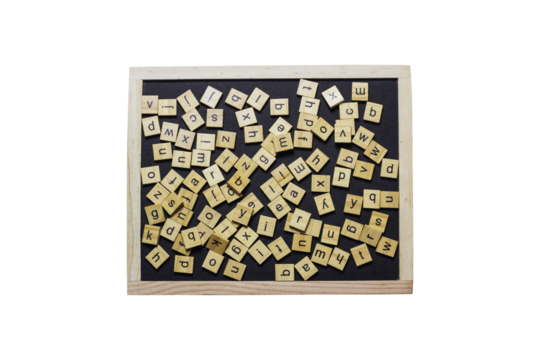 English letters made from square wooden tiles There are English letters scattered on a black background. Concepts for developing grammar thinking