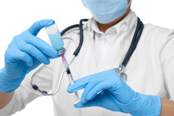 Doctor filling syringe with medication from glass vial on white background, closeup