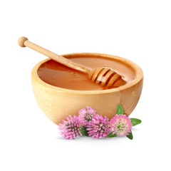 Honey in wooden bowl, dipper and clover flowers isolated on white