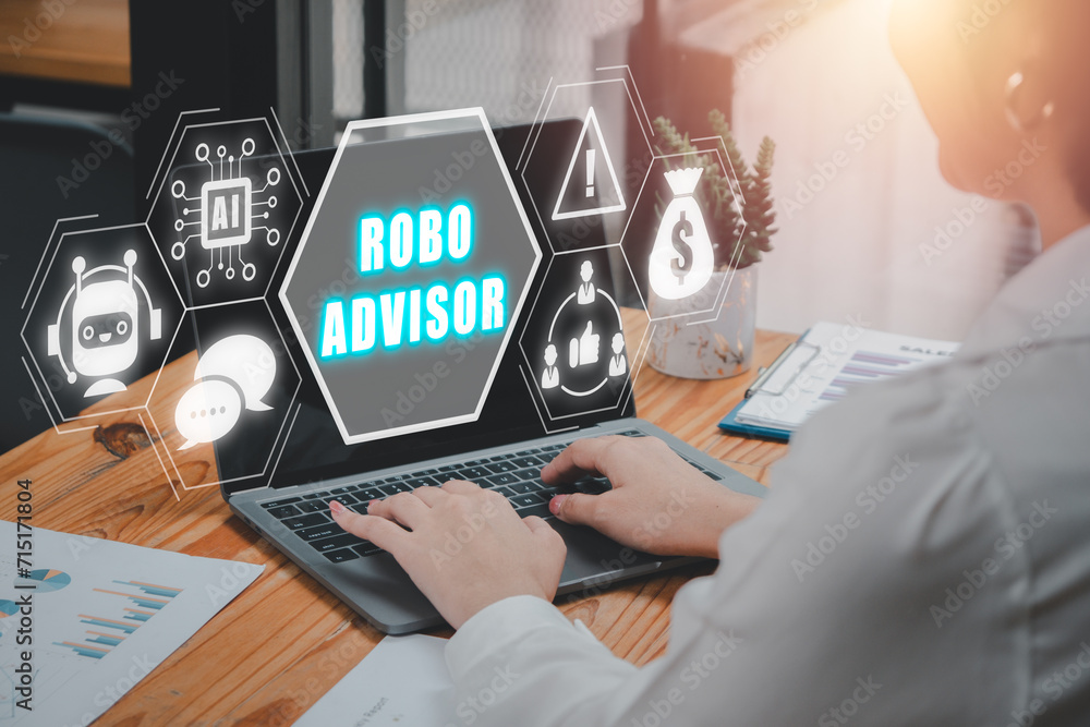 Poster robo advisor concept. business woman using laptop computer on desk with robo advisor icon on virtual