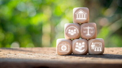 Social policy concept. Wooden block on desk with Social policy icon on virtual screen. Government,...