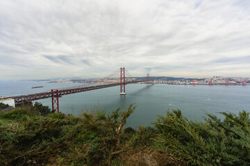 25 de Abril Bridge, a suspension bridge connecting the city of Lisbon to the municipality of Almada, Portugal