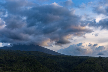 Heavy clouds over a dense forest, mountains of Bali near Munduk, Indonesia
