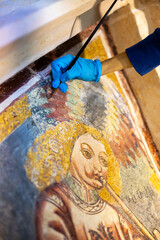 Female Expertise Restorer Hand Retouching Gothic Fresco Close Up