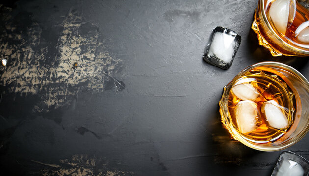 Whiskey with ice. Top view with copy space. high quality photo on a black background