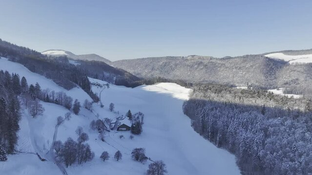 Snow-covered meadows in the valley with wooded limestone ribs in winter, Untere Rueti, drone image, Ramiswil, Solothurn, Switzerland, Europe