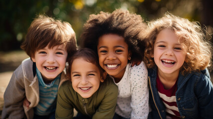 Group of diverse cheerful fun happy multiethnic children outdoors in the sunshine