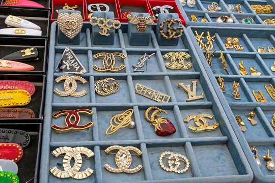 Big fashion brands costume jewelry counterfeits sold on market