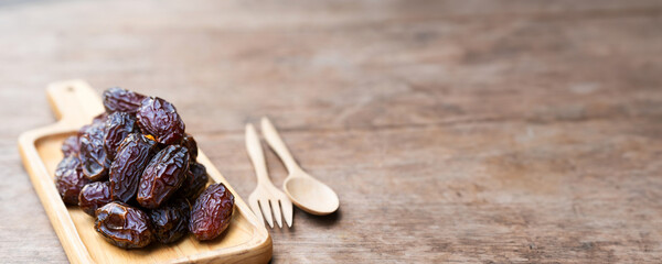 Dried dates are high in sugar, rich in nutrients and are commonly eaten during the Muslim fasting month of Ramadan. Copy space.