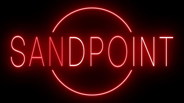 Flickering red retro style neon sign glowing against a black background for SANDPOINT