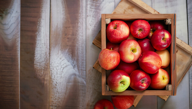 Ripe red apples in wooden box. Top view with space for your text. high-quality photo