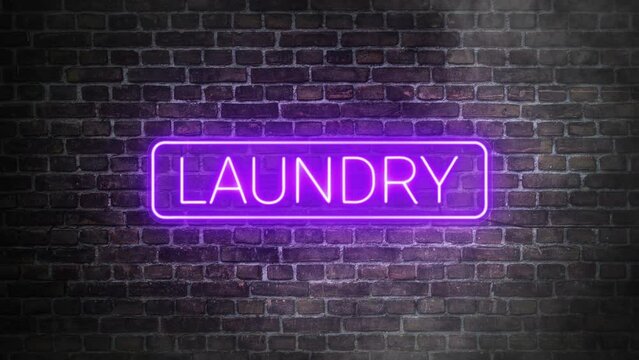 Laundry neon signboard on bricks wall background. Concept of laundry store front. Illuminated laundry sign with rounded rectangle frame in purple neon.