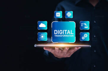 Embrace digital transformation with technology. Businessman use tablet with digital transformation icon on a screen, incorporating IoT and the internet of things.