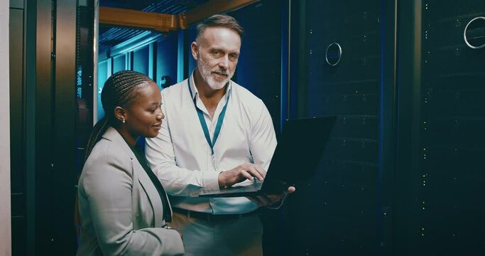 Engineering team, laptop and server room for cloud computing, programming and hardware solution. Face of senior man, woman or technician in data center with information technology or computer coding - Powered by Adobe