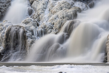 Afternoon winter aerial photo of frozen Ithaca Falls on Fall Creek, City of Ithaca, NY, USA...