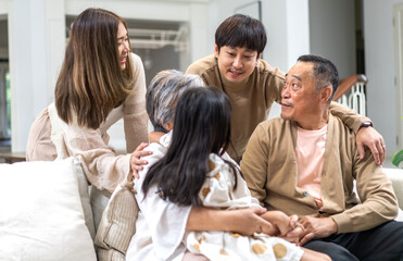 Portrait of happy love family asian father and mother playing with adorable asian kid girl.daughter, care, insurance.Happy family moments good time love with grandparents.Love of big family.