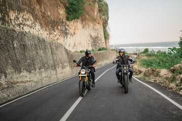 Obraz premium potrait of asian men enjoying riding motorcycle, leisure activity concept