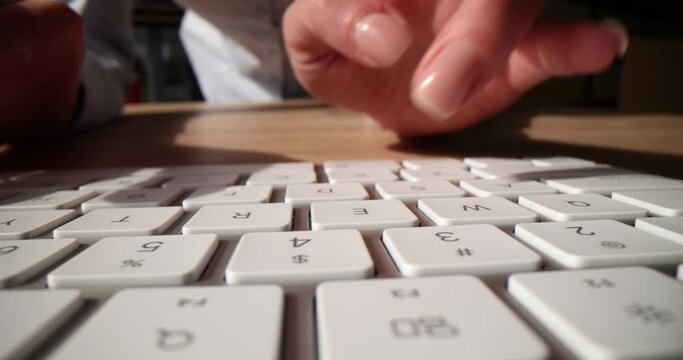 Closeup business people typing hands on computer keyboard to use internet