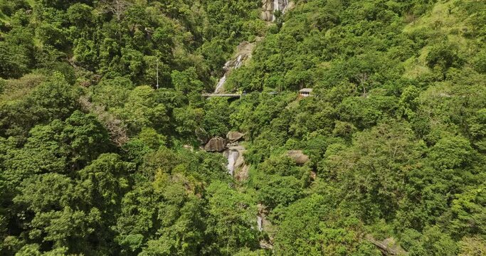 Ella Sri Lanka Aerial v44 cinematic drone flyover A23 bridge capturing gushing Ravana waterfall with water cascading down the rocks, forming natural water pool - Shot with Mavic 3 Cine - April 2023