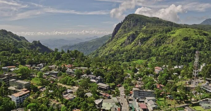 Ella Sri Lanka Aerial v35 drone flyover town center nestled in central highlands capturing hillside resort hotels, residential, verdant valleys and mountainscape - Shot with Mavic 3 Cine - April 2023