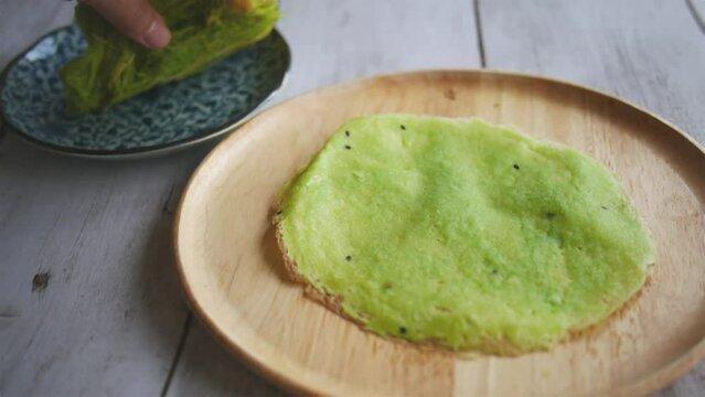 Footage video of how to eat cotton candy floss roti or Roti Sai Mai, hand folding wrap and rolls, Chapati, Paratha, Thai traditional local dessert snack