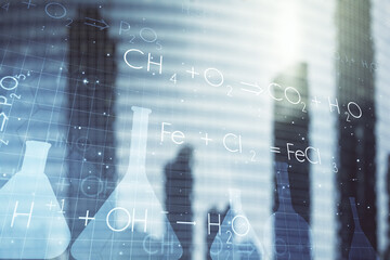 Double exposure of abstract virtual chemistry hologram on modern skyscrapers background, research and development concept