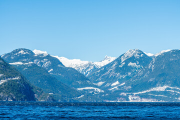 ocean view with mountains, blue sky