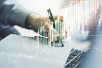 Abstract creative financial graph with hand writing in notebook on background, forex and investment...