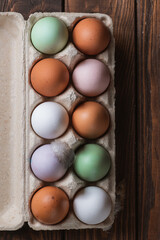 Colorful eggs on a wooden table
