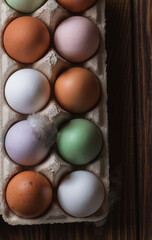 Colorful eggs on a wooden table