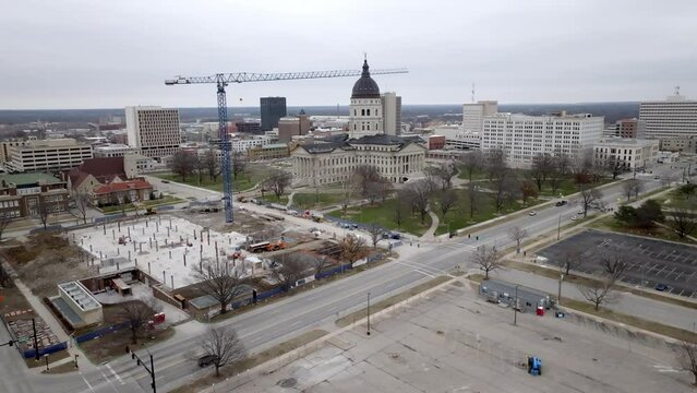 Kansas state capitol building in Topeka, Kansas with drone video moving angled wide shot.