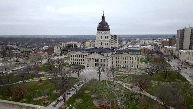 Kansas state capitol building in Topeka, Kansas with drone video moving out medium shot.