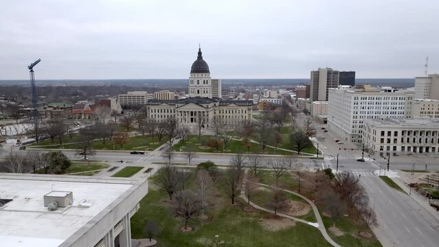 Kansas state capitol building in Topeka, Kansas with drone video moving in medium shot.