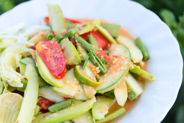 Young melon thai salad in white dish  