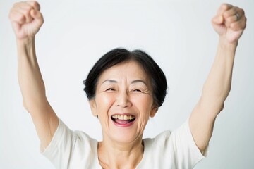 歓声をあげて応援する笑顔の日本人女性のおばあちゃん（白背景・オリンピック・日本代表・ワールドカップ・世界大会・Jリーグ・野球・スポーツ） - obrazy, fototapety, plakaty